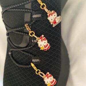 1 set of 2 hello kitty charms to clip any where.  Cute Charms